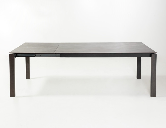 Extended dark-colored Arquus table