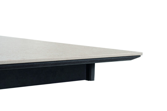 Detail of the beveled base that supports the ceramic, lacquered to match the rest of the table.